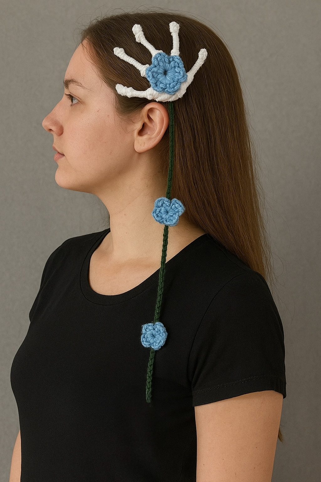 Skeleton hand hair clip with blue cascading crochet flowers